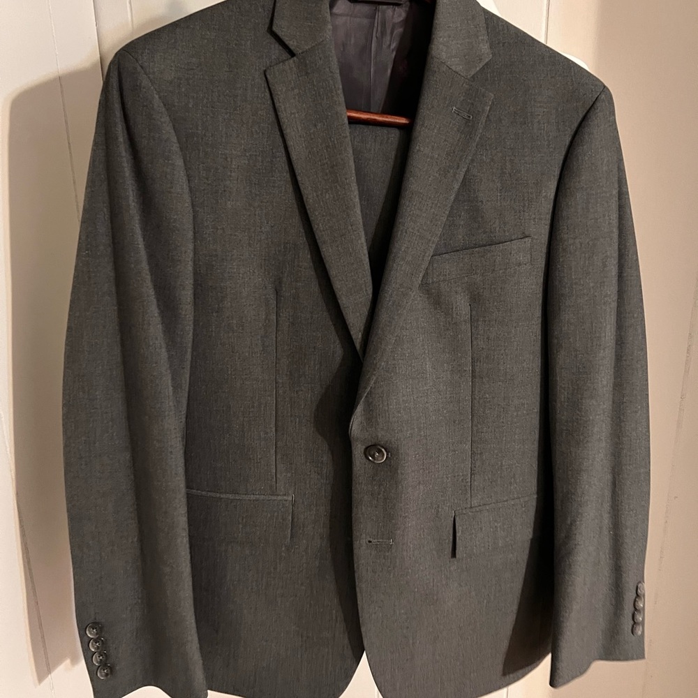 Ryan Seacrest charcoal suit